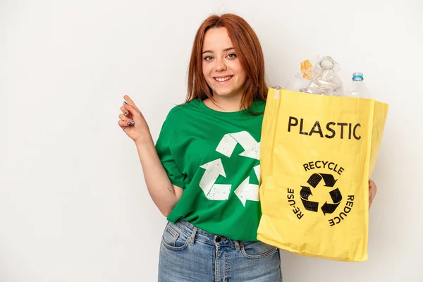 Young Caucasian Woman Recycled Plastic Isolated White Background Smiling Pointing — Zdjęcie stockowe