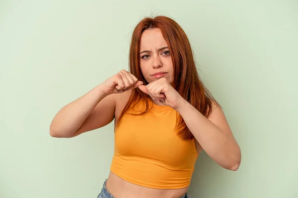 Young Caucasian Woman Isolated Green Background Throwing Punch Anger Fighting — Stock Photo, Image