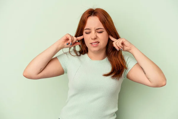 Young Caucasian Woman Isolated Green Background Covering Ears Fingers Stressed — Stock Photo, Image