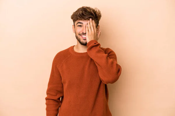 Young Arab Man Isolated Beige Background Having Fun Covering Half — Stock Fotó