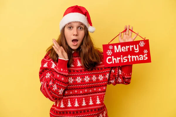 Little Caucasian Girl Holding Merry Christmas Placard Isolated Yellow Background — Stock Photo, Image