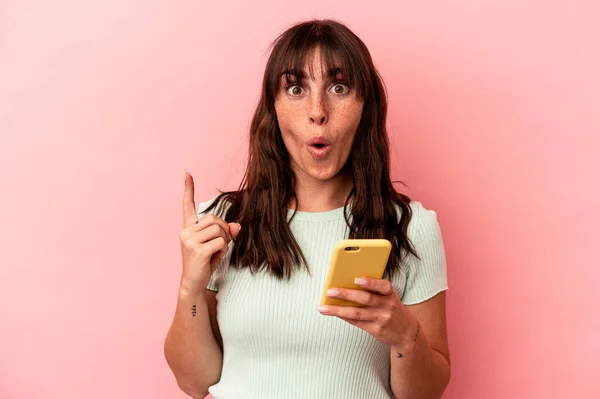 Young Argentinian Woman Holding Mobile Phone Isolated Pink Background Having — 스톡 사진