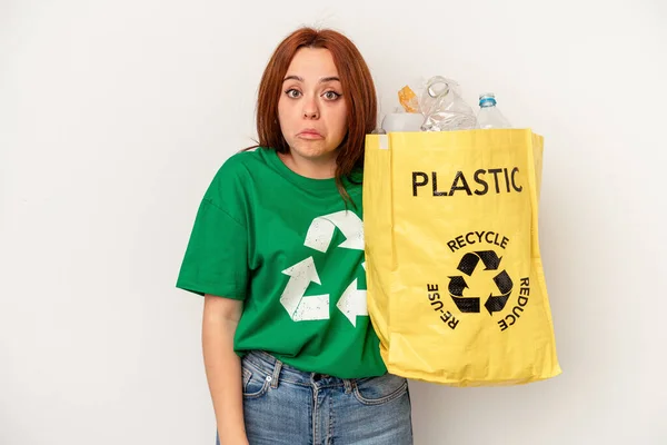 Young Caucasian Woman Recycled Plastic Isolated White Background Shrugs Shoulders — 图库照片