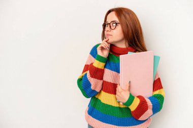Young student caucasian woman isolated on white background looking sideways with doubtful and skeptical expression.