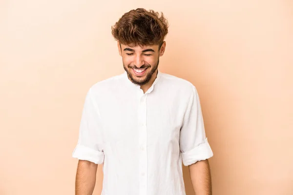 Young Arab Man Isolated Beige Background Laughs Closes Eyes Feels — Stok fotoğraf