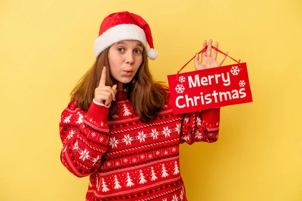 Little Caucasian Girl Holding Merry Christmas Placard Isolated Yellow Background — Stock Photo, Image