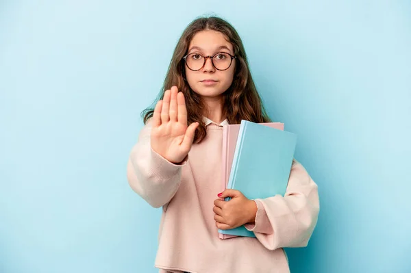 Little Caucasian Student Girl Holding Books Isolated Blue Background Standing — стоковое фото