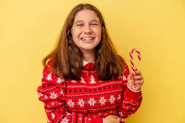 Little Caucasian Girl Holding Christmas Stick Isolated Yellow Background Laughing — 스톡 사진