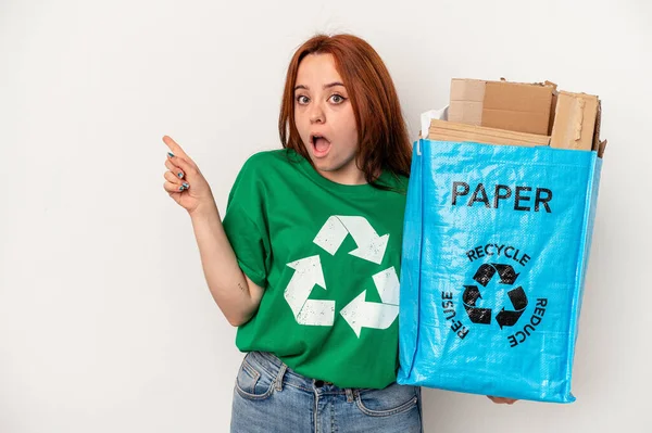 Young Caucasian Woman Recycled Paper Isolated White Background Pointing Side — Stock fotografie