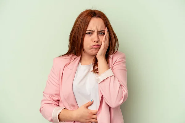 Young Caucasian Woman Isolated Green Background Blows Cheeks Has Tired — Stock Photo, Image