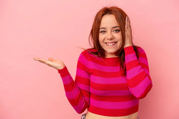 Young Caucasian Woman Isolated Pink Background Holds Copy Space Palm — Stock Photo, Image