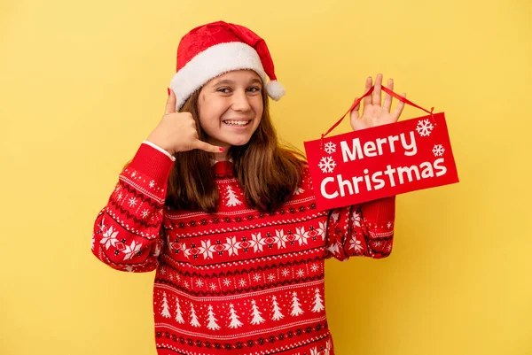 Little Caucasian Girl Holding Merry Christmas Placard Isolated Yellow Background — 스톡 사진