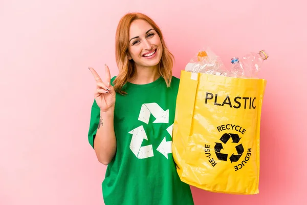 Young Caucasian Woman Recycled Plastic Isolated Pink Background Joyful Carefree — Stockfoto