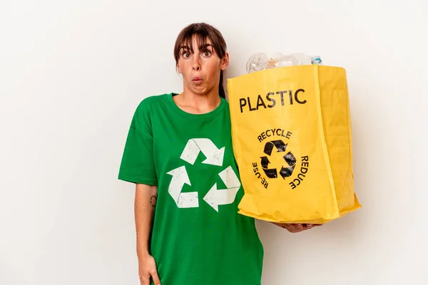 Young Argentinian Woman Recycled Plastic Isolated White Background Shrugs Shoulders —  Fotos de Stock