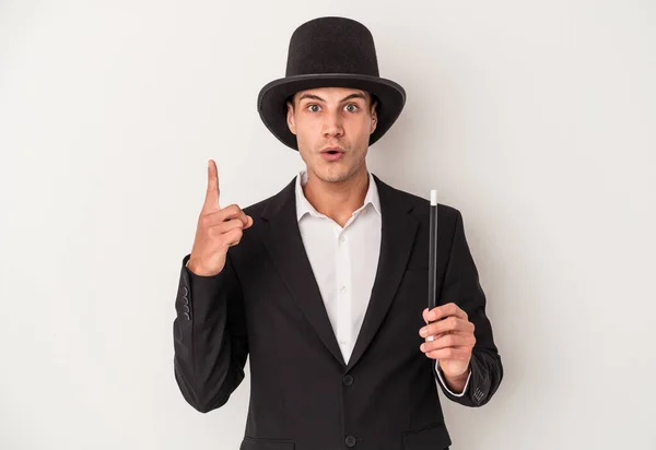 Young Magician Caucasian Man Holding Wand Isolated White Background Having — Stock Photo, Image