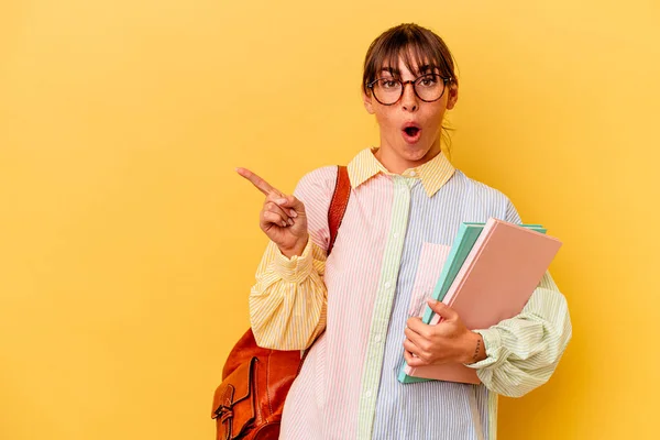 Young Student Argentinian Woman Isolated Yellow Background Pointing Side —  Fotos de Stock