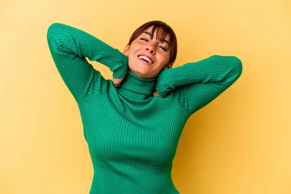 Young Argentinian Woman Isolated Yellow Background Stretching Arms Relaxed Position — Foto de Stock
