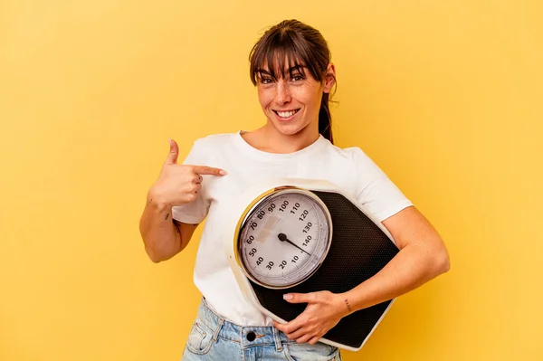 Young Woman Holding Scale Isolated Yellow Background Person Pointing Hand — Stock Photo, Image