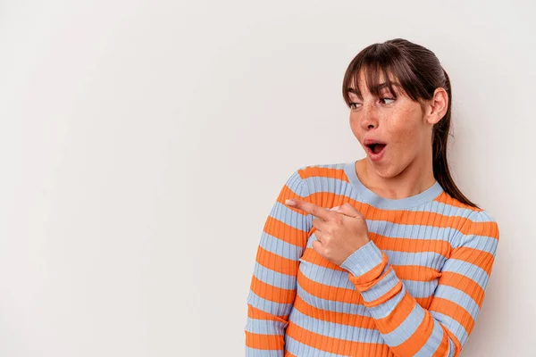 Young Argentinian Woman Isolated White Background Points Thumb Finger Away — стоковое фото