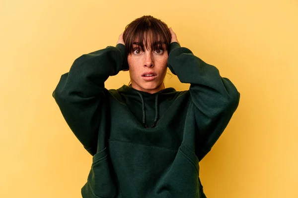 Young Argentinian Woman Isolated Yellow Background Covering Ears Hands Trying —  Fotos de Stock
