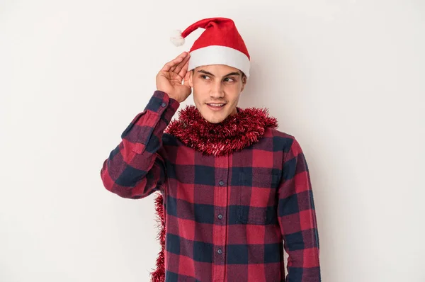 Young Caucasian Man Celebrating Christmas Isolated White Background Trying Listening — Stock Photo, Image