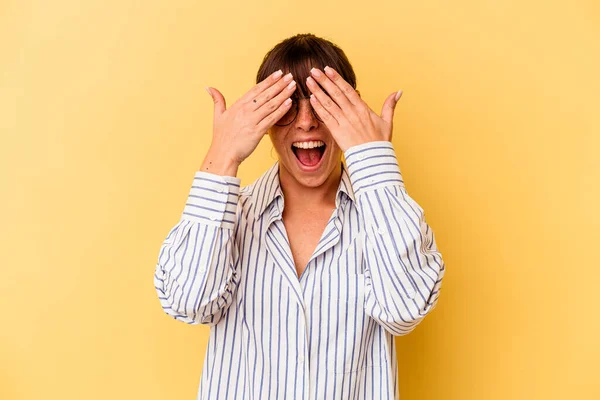 Young Argentinian Woman Isolated Yellow Background Covers Eyes Hands Smiles — ストック写真