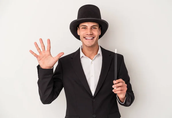 Young Magician Caucasian Man Holding Wand Isolated White Background Smiling — Stock Photo, Image