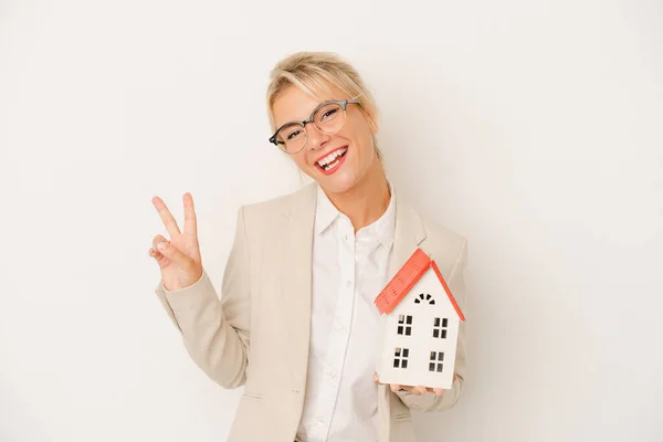 Young Real Estate Agent Woman Holding Home Model Isolated White — Stock Photo, Image