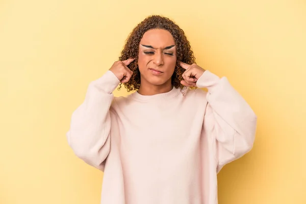 Young Latin Transsexual Woman Isolated Yellow Background Covering Ears Fingers — Stock Photo, Image