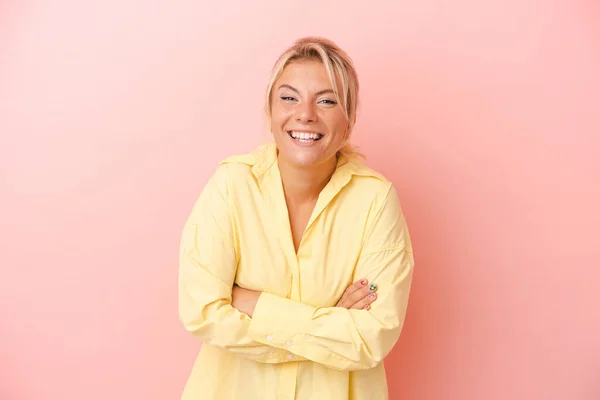 stock image Young Russian woman isolated on pink background laughing and having fun.