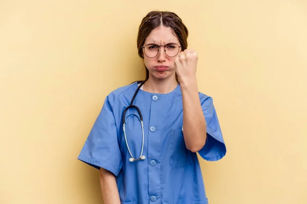 Young Nurse Caucasian Woman Isolated Yellow Background Showing Fist Camera — Stock Photo, Image