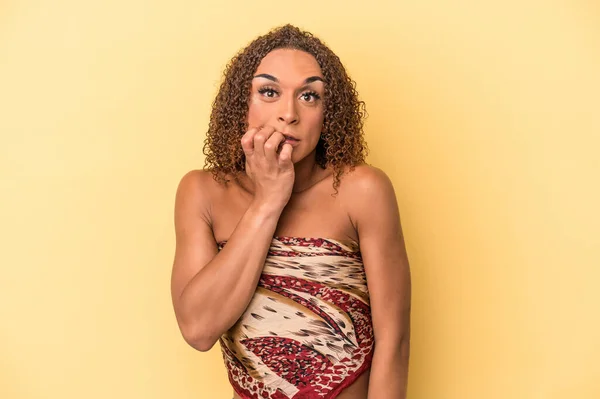Young Latin Transsexual Woman Isolated Yellow Background Biting Fingernails Nervous — Stock Photo, Image