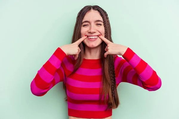 Young Caucasian Woman Isolated Green Background Smiles Pointing Fingers Mouth — Φωτογραφία Αρχείου