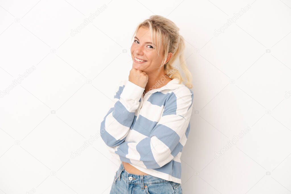 Young Russian woman isolated on white background smiling happy and confident, touching chin with hand.