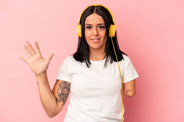 Young Caucasian Woman One Arm Listening Music Isolated Pink Background — Stock Photo, Image