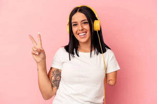 Young Caucasian Woman One Arm Listening Music Isolated Pink Background — Stock Photo, Image