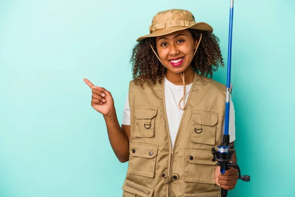 Young African American Fisherwoman Holding Rod Isolated Blue Background Smiling — Stock Photo, Image