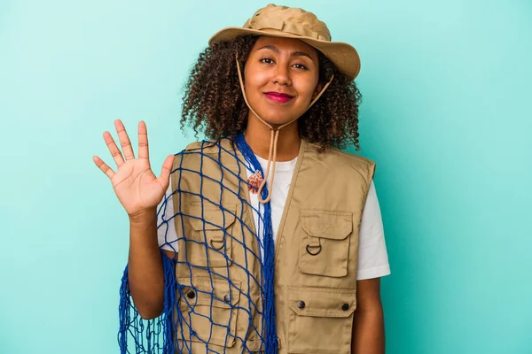 Young African American Fisherwoman Holding Net Isolated Blue Background Smiling — Stock Photo, Image