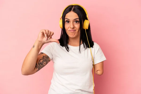 Young Caucasian Woman One Arm Listening Music Isolated Pink Background — Stock Photo, Image