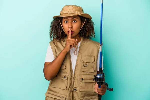 Young African American Fisherwoman Holding Rod Isolated Blue Background Keeping — Stock Photo, Image