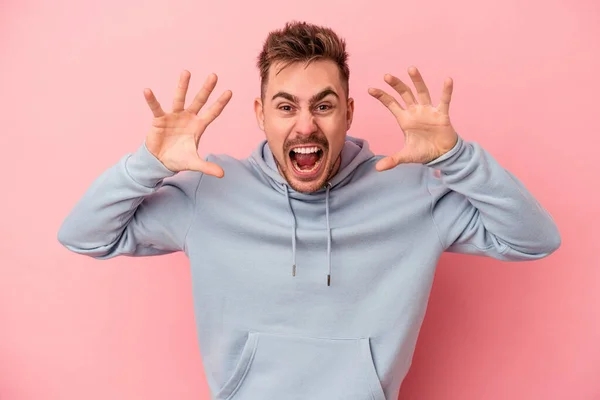 Young Caucasian Man Isolated Pink Background Showing Claws Imitating Cat — Stock Photo, Image