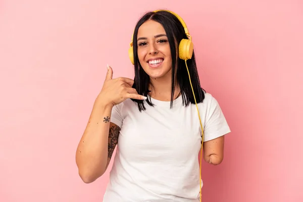 Young Caucasian Woman One Arm Listening Music Isolated Pink Background — Stock Photo, Image