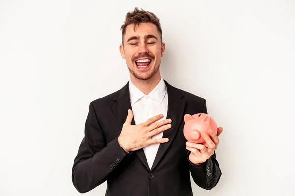 Jovem Homem Negócios Caucasiano Segurando Porquinho Banco Isolado Fundo Branco — Fotografia de Stock