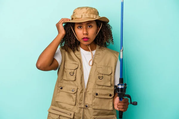 Young African American Fisherwoman Holding Rod Isolated Blue Background Being — Stock Photo, Image