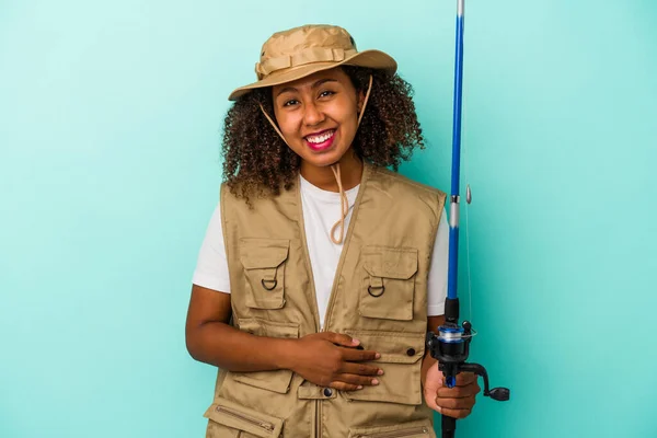 Young African American Fisherwoman Holding Rod Isolated Blue Background Laughing — Stock Photo, Image