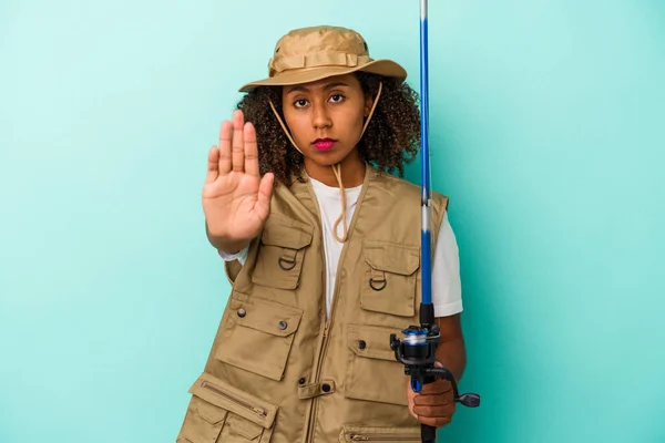 Young African American Fisherwoman Holding Rod Isolated Blue Background Standing — Stock Photo, Image