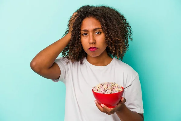 Young African American Woman Holding Bowl Cereals Isolated Blue Background — Stock Photo, Image