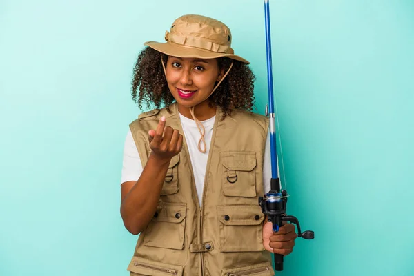 Young African American Fisherwoman Holding Rod Isolated Blue Background Pointing — Stock Photo, Image