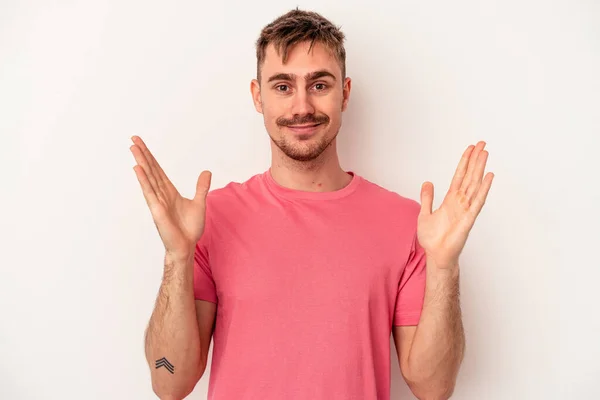 Young Caucasian Man Isolated White Background Laughing Keeping Hands Heart — Stock Photo, Image