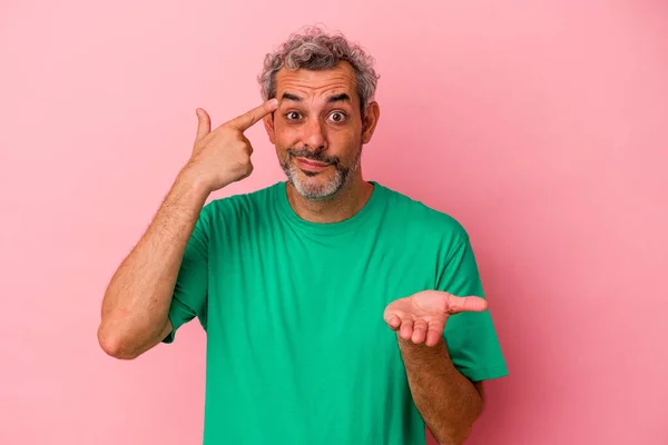 Middle Age Caucasian Man Isolated Pink Background Holding Showing Product — 스톡 사진